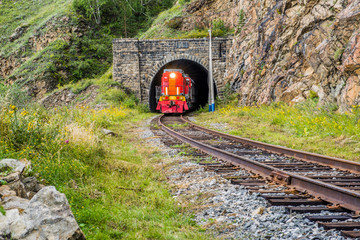 a train comes out the tunnel