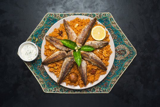 Fish Kabsa - mixed rice dishes that originates in Yemen. Middle eastern food.