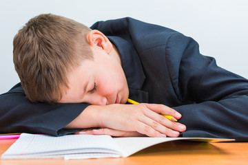 boy fell asleep during homework lesson