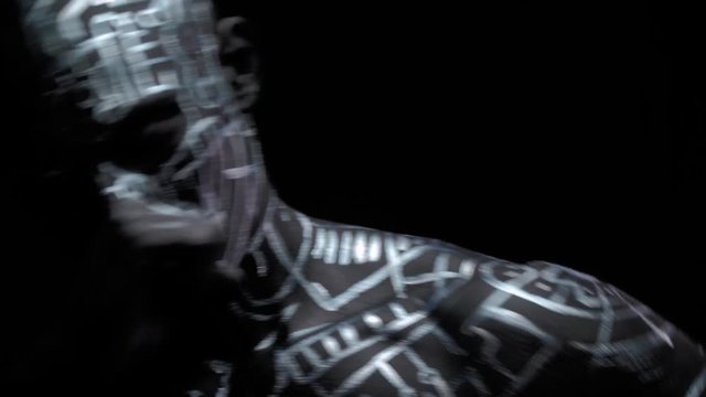 Close up of the creepy man with body paint, throwing punches, 4k