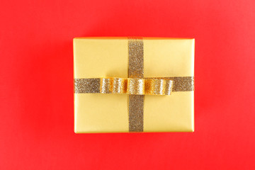 Multi purpose festive composition with present wrapped in colorful paper and tied with satin silk bow. Gift box for differet occasions. Close up, top view, copy space, background, flat lay.