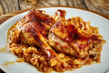 Roasted duck legs on cabbage