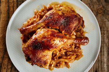 Roasted duck legs on cabbage