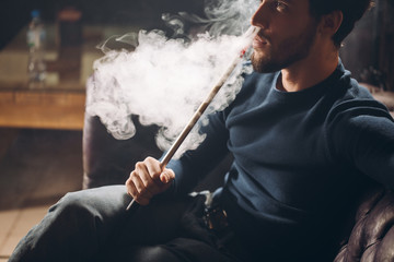 young cool guy enjoying luxury life. close up cropped side view photo free liver. man enjoying life