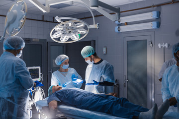 Surgery preparations. Surgical team preparing their patient for surgery. Healthcare medicine professionalism copyspace