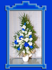 White and blue flowers in a jug