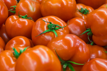 Ripe tomatoes at a farmer's market, healthy food