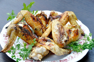 apetitic fried chicken cranberries in a plate on a dark wooden table