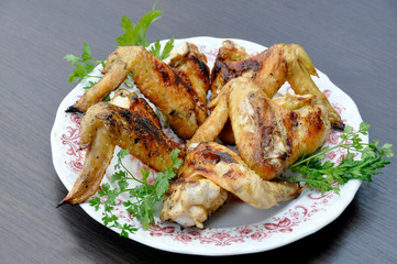 apetitic fried chicken cranberries in a plate on a dark wooden table