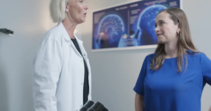 Slow Motion Portrait of Pediatric Neurologist With Patients