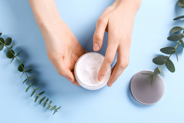 Moisturizing care skincare face cream for healing complicated troubled skin type in an open jar...