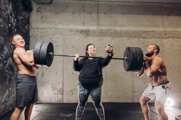 funny plump wwoman taking a selfie while training in fitness centre.crazy workout.madness