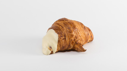 croissant with cream filling on a white background