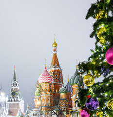 Fototapeta na wymiar Christmas and New Year Decorations in Moscow Red square near the St. Basil's Cathedral night view