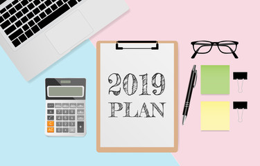 2019 GOALS text on white note paper with laptop computer, coffee cup, tablet, calculator and pen on green and yellow paper background. Vector illustration