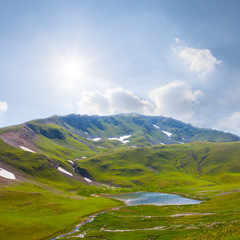 beautiful green mountain  valley with small lake