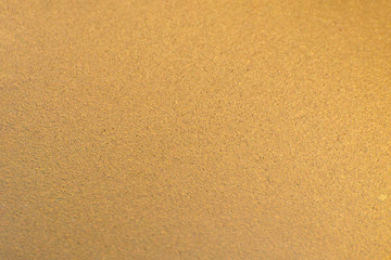Fototapeta na wymiar Wall painted with bronze paint. Gradient texture