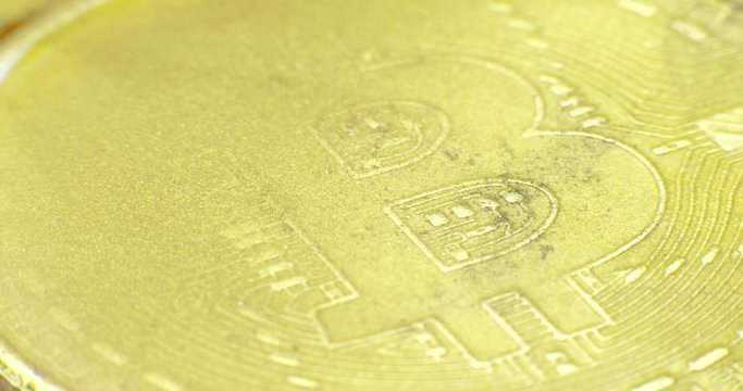 Crypto currency Gold Bitcoin - BTC - Bit Coin in gold paints. 4K. Macro.
