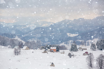 Snowfall in winter mountains