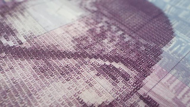 Panning over 50 new shekel banknote in macro view.