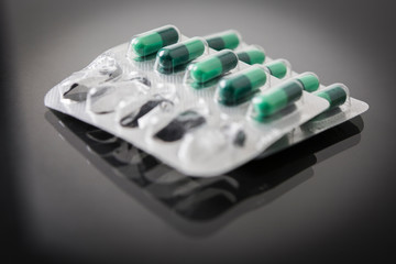 packing of green capsules