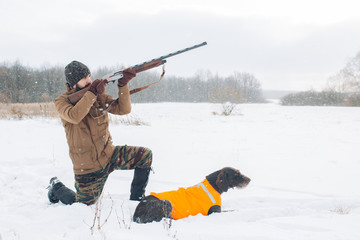 venturious hunter is going to bring down a bird. side view full length photo