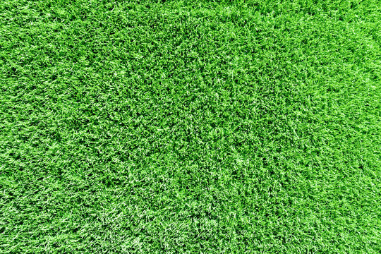 the texture of artificial green grass. landscape, decor.