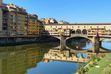 Obraz premium Ponte Vecchio Bridge over river Arno at sunny day. Florence. Italy