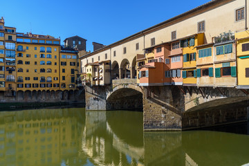 Fototapeta na wymiar Ponte Vecchio Bridge over river Arno at sunny day. Florence. Italy
