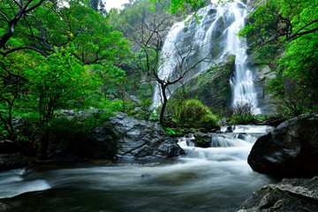 Beautiful great waterfall in tropical forest at Khlong Lan National park, Kamphaeng Phet, Thailand