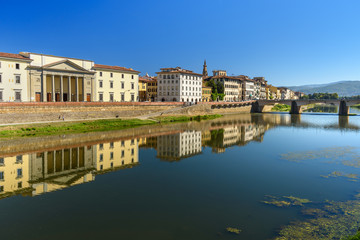 Fototapeta na wymiar Embankment of Arno river at sunny day in Florence, Italy