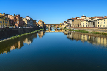 Fototapeta na wymiar Ponte Vecchio Bridge over river Arno at sunny day. Florence. Italy