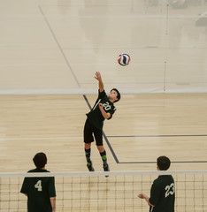 Volleyball player serving the ball