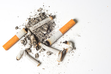 Cigarette burns at the white background.