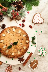 Homemade Christmas fruitcake on festive Xmas holiday background