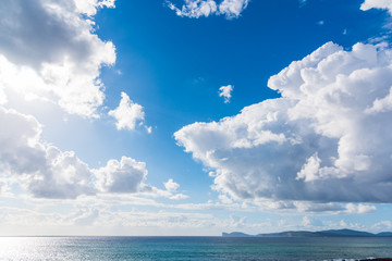 Obraz premium Soft clouds over the blue sea in Sardinia