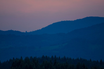 Beautiful scenery with forest, mountains and clear sky