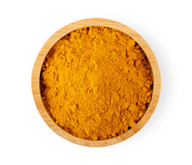 Turmeric powder in wood bowl isolated on white background
