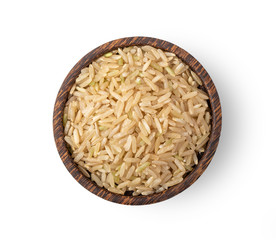 brown rice in wood bowl  isolated on white background. top view
