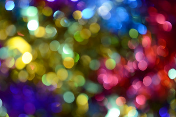 Bokeh. Holiday background. Christmas lights. Glitter. Defocused sparkles. New Year backdrop. Festive wallpaper. Blinks. Carnival. Tinsel. Bokeh retro style photo.