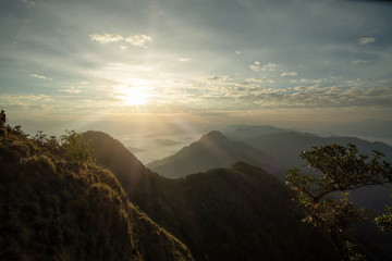 scenic mountain lined with alternates. The morning sun shines and fog covered the mountain. Doi KALHEPU, Mae Moei, Tak in Thailand