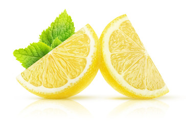 Isolated lemon wedges. Two pieces of lemon fruit with mint isolated on white background with clipping path