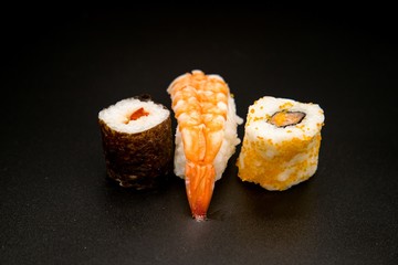 sushi on black background