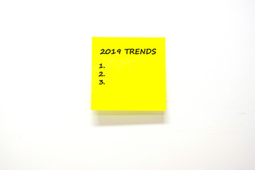 2019 Trends  text with stick note paper or post it on white background. reminder and business concept