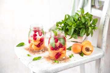 Cold Fruit Infused Detox Water with apricots raspberries and mint