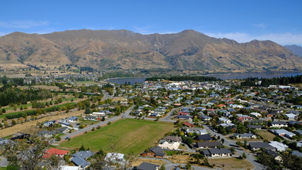 Fototapeta na wymiar Wanaka town suburbs from Mt. Iron, New Zealand
