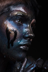 Portrait of a beautiful girl with creative, fantasy makeup.