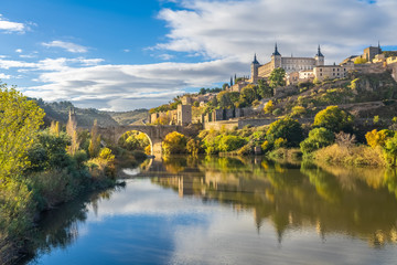 The Alcazar of Toledo from the Alcantara Bridge, Castile-La Mancha, Spain - obrazy, fototapety, plakaty