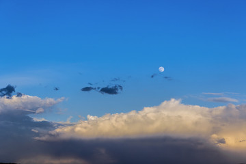 clouds on blue sky background with moon