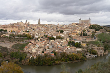 Fototapeta na wymiar Skyline of old city of Toledo, Castile-La Mancha, Spain. View from the Ermita del Valle (Hermitage of Virgen del Valle) on the opposite bank of the river Tagus.